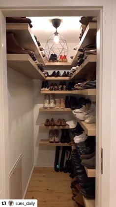 an open closet filled with lots of shoes