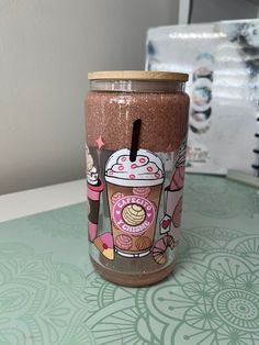 a pink and brown cup sitting on top of a table