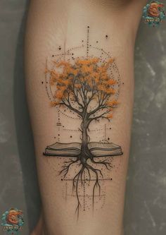 a tree with orange leaves on the side of a woman's leg