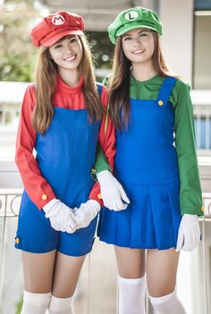 two young women dressed in mario and luigi costumes posing for the camera, both wearing matching outfits