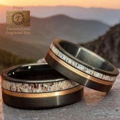 A unique man and woman wedding ring crafted from black brushed tungsten carbide, featuring an inlay of deer antler & rose gold strip, This unique combination embodies a rustic yet refined aesthetic, symbolizing strength and the blending of natural elements with a touch of elegance. Ring Specifications: *Metal: Tungsten Carbide *Inlay: Deer Antler *Color: Black *Width: 8mm & 6mm *Fit: Comfort Fit *Size: True to size *Protection: Coated for resistance against dirt, grime, and moisture Package Includes: 1 x Tungsten Carbide Ring 1 x Wooden Ring Box ► Ideal for engagements, anniversaries, proposals, and promise rings. ► Crafted from distinctive materials, each inlay pattern is unique. No two are precisely the same. Why Choose Us? * Enduring Craftsmanship: Each ring is crafted for continuous we Couples Wedding Bands, Wooden Ring Box, Tungsten Carbide Rings, Men's Wedding Ring, Tungsten Carbide, Ring Crafts, Tungsten Ring, Wooden Rings, Wedding Rings For Women