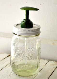 a mason jar with a soap dispenser on it