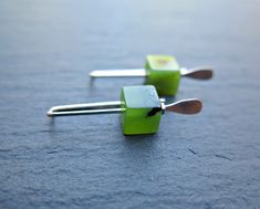 "These small green jade earrings from my studio in Canada feature natural nephrite jade stones in a great cube cut. The 6mm stones are each slightly different in opaque shades of leaf green with black patterns characteristic of this type of jade. The jade cubes sit on tiny silver coated hematite stones on silver plated earwires. Please expect similar leaf green colours and black patterns in each pair of earrings as every stone is unique. The earrings are 1\" (25mm) long and will be shipped in a splurge gift tin.  Join me in my shop here: https://www.etsy.com/shop/Splurge" Cube Earrings, Thick Necklace, Green Colours, Soldering Jewelry, Hematite Stone, Nephrite Jade, Jade Earrings, Leaf Green, Tin Gifts