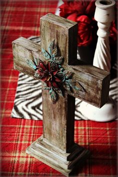 a wooden cross sitting on top of a table