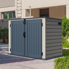 an outdoor storage shed in front of a building