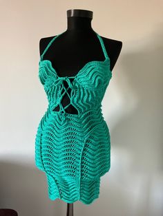 a crocheted dress on a mannequin