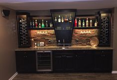 a home bar with liquor bottles on the shelves