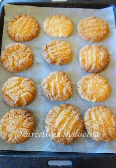 twelve cookies are on a baking sheet ready to be baked in the oven for consumption