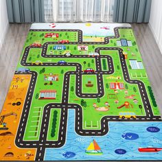 a child's play mat with cars and trucks on it