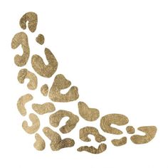 gold foiled footprints in the shape of an animal's paw on a white background