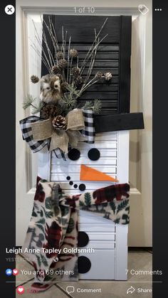 a snowman made out of an old piano with pine cones and other decorations on top