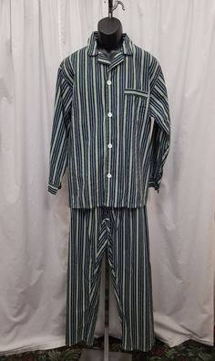 Vintage 1980s 2 Piece NWOT Towncraft Green & Navy Stripe Print Button Shirt Pants Lounger Polycotton Pajamas Set, PJs.  Excellent new condition - see pics!  Shirt has a 3 button closure, long sleeves, and 1 front pocket.  Pants have a 2 snap closure and adjustable fit along with elastic.  Shirt Measurements:  shoulder to shoulder 20 in, chest 50 in, sleeves shoulder to cuff 23, sleeves pit to cuff 19 1/2, back of neck to bottom 29 1/2 inches. Pants Measurements: waist 32 stretch to 40, length 43 80s Outfits, Adult Pajamas, 80s Outfit, Pajama Robe, Pajamas Set, Shirt And Pants, Navy Stripes, Button Shirt, Green Stripes