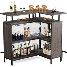 an open bar with liquor bottles and glasses on the top shelf, in front of a white background