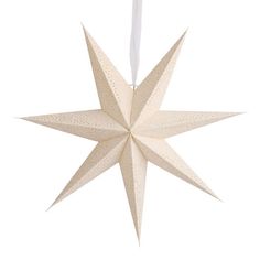 a paper star ornament hanging from a string