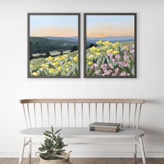 two paintings are hanging on the wall next to a bench with a potted plant