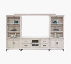 a white entertainment center with shelves and drawers