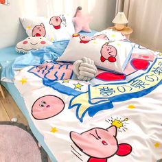 a bed with cartoon characters on it and pillows in front of the headrests