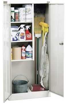 an open cabinet with cleaning supplies and brooms