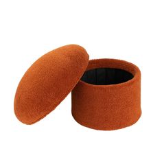 an orange ear cushion with black lining on the top and bottom, in front of a white background