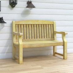 a wooden bench sitting in front of a white wall with several hanging lights on it