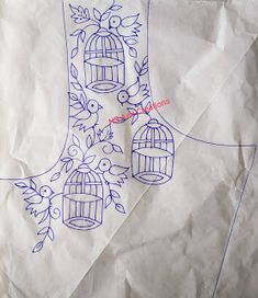 a piece of paper with a drawing of a boot and birdcage on it