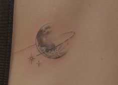 a woman's stomach with a small tattoo on the side of her belly and an airplane flying in front of it