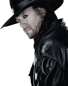 a man wearing a black hat and leather jacket