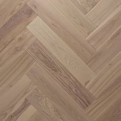 an image of wood flooring that looks like herringbones