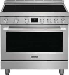 a stainless steel oven with four burners