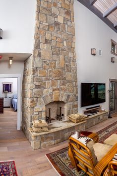 a large stone fireplace in a living room