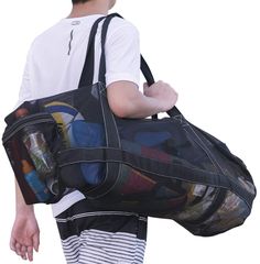 a man carrying a large duffel bag on his back