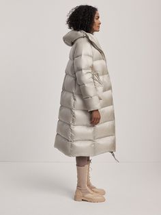 Longline with an exaggerated, oversized fit. This style is intentionally oversized. For a more tailored look, we recommend sizing down. Model is 5'10", with a 33" bust, 24" waist, 34.5" hips, and is wearing a size small. Oversized Puffer Coat, Oversized Puffer, Down Puffer Coat, Winter Warmers, Puffer Coat, High Collar, Long A Line, Oversized Fits, Puffer