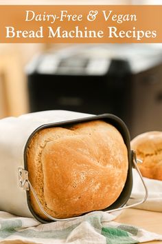 a loaf of bread sitting on top of a table next to a bag with the words dairy - free and vegan bread machine recipes