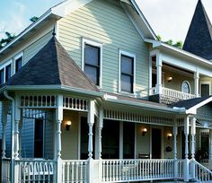 two story house with white trim and black roof