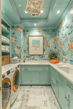 a washer and dryer in a room with floral wallpaper on the walls