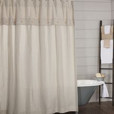 a bath room with a tub and a shower curtain