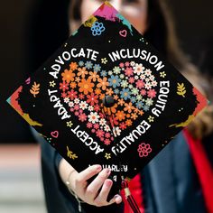 a woman in a graduation cap with flowers on it