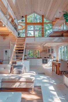 a living room filled with furniture and a spiral staircase leading up to the second floor