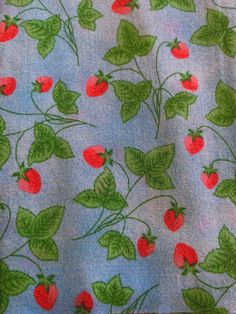 the fabric has cherries and leaves on it