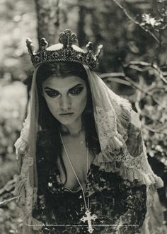 black and white photograph of a woman wearing a crown