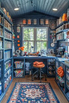 a kitchen with blue walls and shelves filled with pots, pans and other items