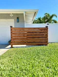 a wooden fence in front of a house