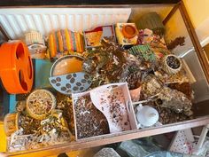 an open drawer filled with lots of assorted items