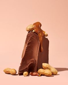 a piece of chocolate with peanuts on top