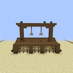 a small wooden structure sitting in the middle of a desert with two bells on top