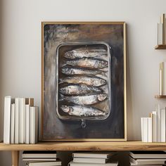 an oil painting of fish in a metal pan on a shelf next to some books