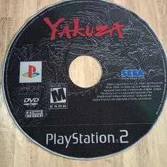 a video game disc with the title yakuza playstation on it's side