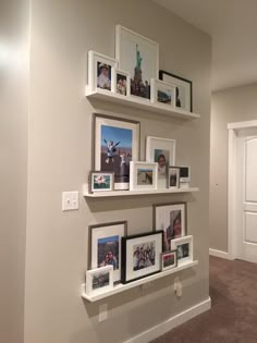 the wall is filled with pictures and frames