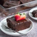 a piece of chocolate cake with strawberries on top