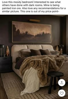 the bedroom is decorated in dark tones and has a large painting on the wall above the bed